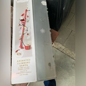 Animated Climbing Santa with Red Ladder